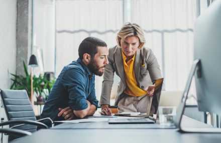 Business,Team,Making,Conversation,At,Sunny,Meeting,Room